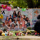 A mourner stops to pay his respects at a memorial at Robb Elementary School, created to honor the victims killed in the recent school shooting, June 9, 2022, in Uvalde, Texas.